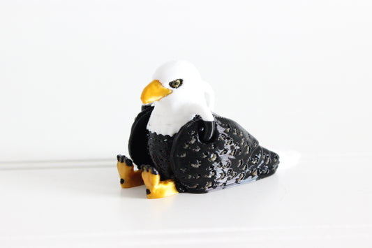 3D-printed brown-and-white eagle keychain showing its sculpted details and segmented design.