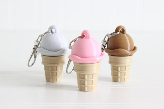 Cookies and Cream, Strawberry, and Chocolate swirl ice cream cones