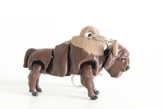 3D-printed brown bison keychain with a silver swivel quick-clip on a white background.
