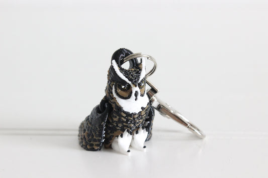 3D-printed brown great horned owl keychain with a silver swivel quick-clip on a white background.