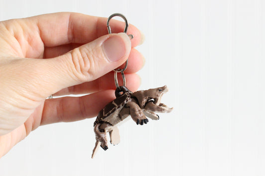 Common Snapping Turtle Keychain held in a person's hand for size reference