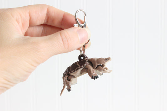 Common Snapping Turtle Keychain held in a person's hand for size reference